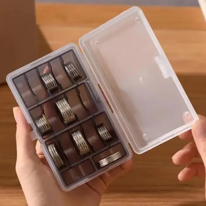 Boîte de rangement de pièces de monnaie multifonctionnelle
