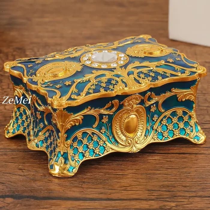 Boîte à bijoux vintage élégante avec détails dorés