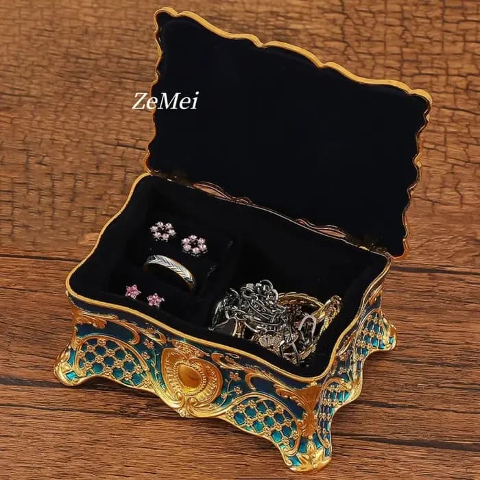 Boîte à bijoux vintage élégante avec détails dorés