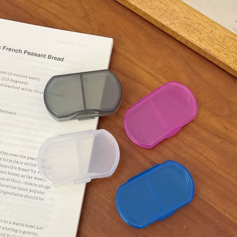 Boîte à pilules transparente à 2 compartiments
